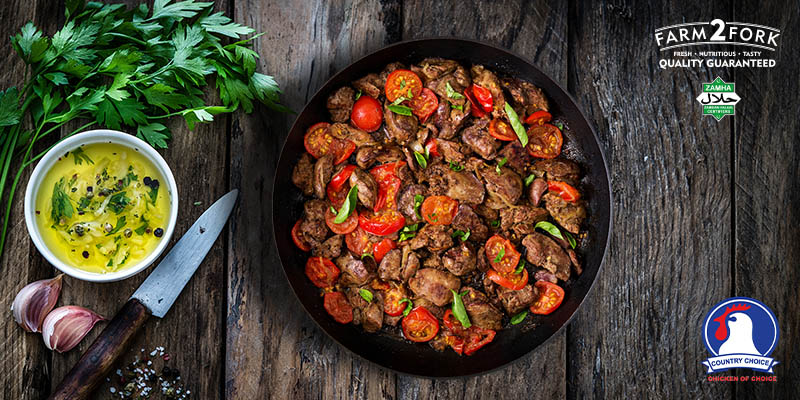 A bowl of garlic chicken liver garnished with basil leaves | Country Choice Chicken Liver