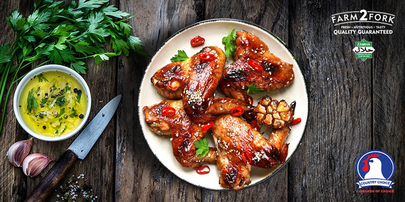 Plated Sticky Honey Soy Sauced Chicken wings garnished with coriander | Country Choice Chicken Wings