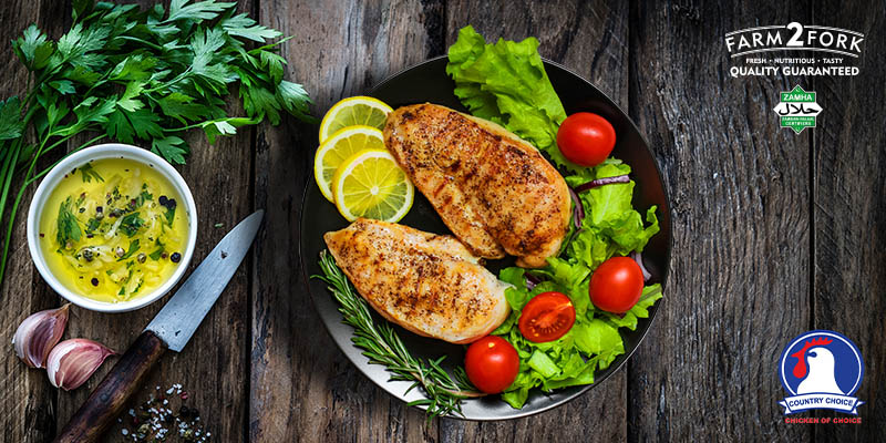 Plated lime chicken beautifully garnished with cherry tomatoes | Country choice chicken breasts pack